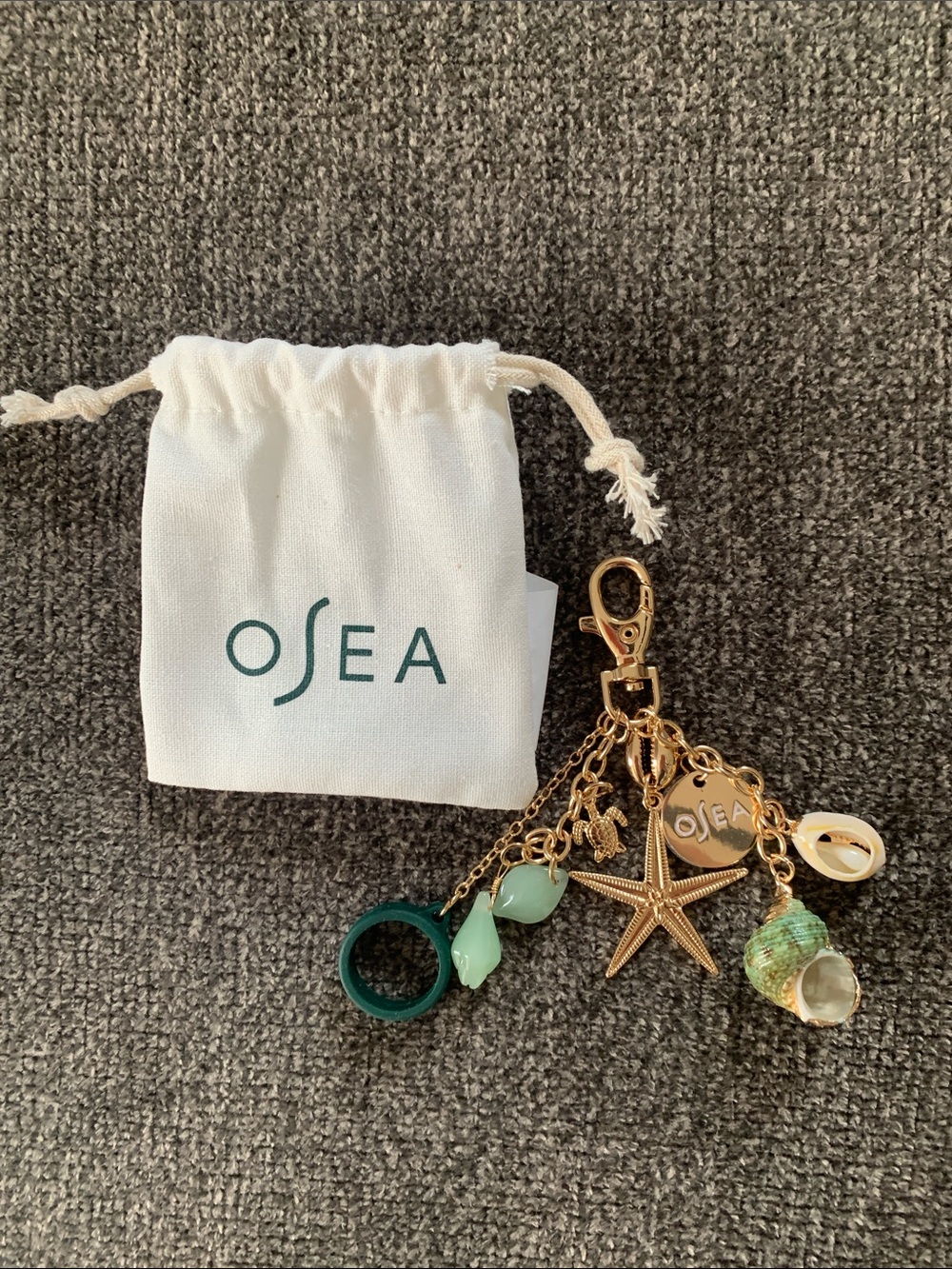 OSEA Gold Keychain with Green Accents